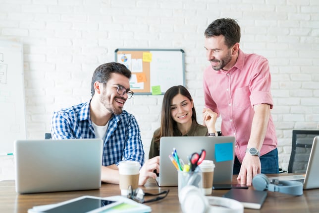 male-female-business-people-communicating-laptop-meeting-workplace